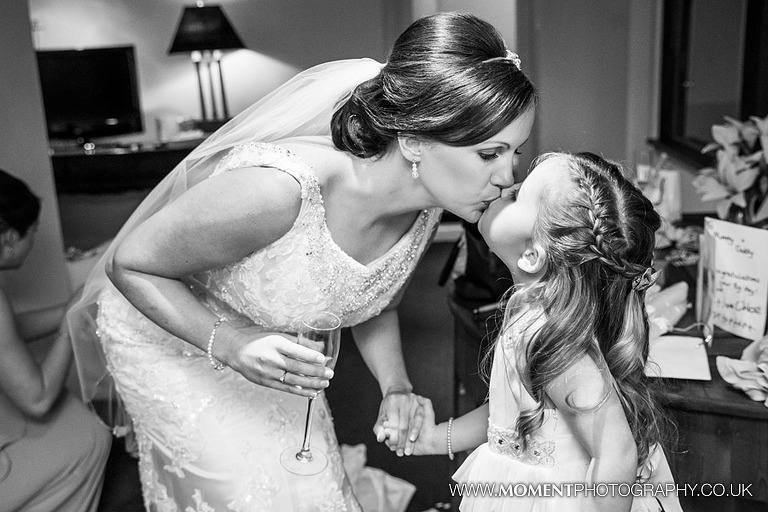 Bride kissing her daughter before getting married
